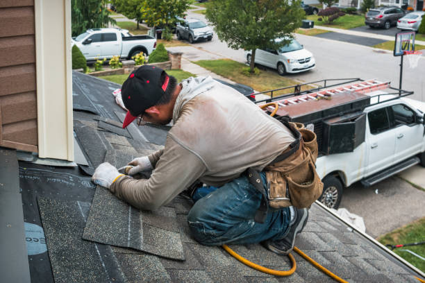 Professional Roof Replacement technician working in Alto, MI